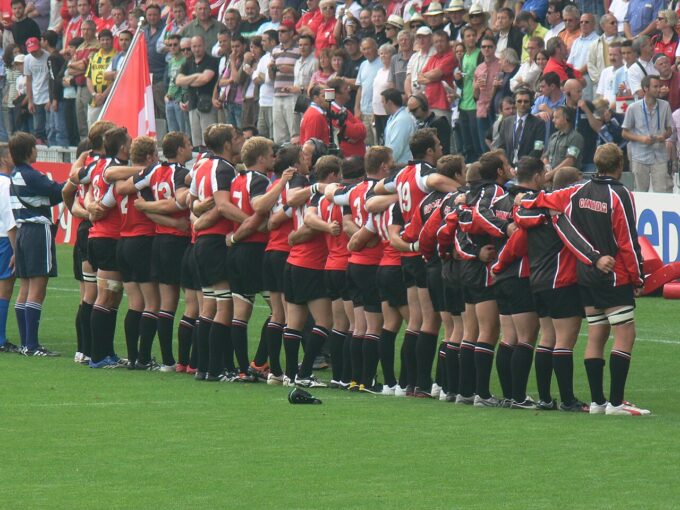 L’impact des nouvelles technologies sur le rugby canadien : transferts, fans et économie numérique Canada rugby team during anthems at RWC